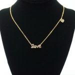 The Love Necklace Gold with Multi Stones on Stand
