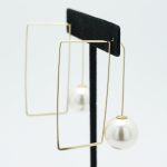 Abstract Pearl Drop Square Earrings in Gold on Stand