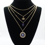 Evil Eye Necklace Set in Gold on Stand