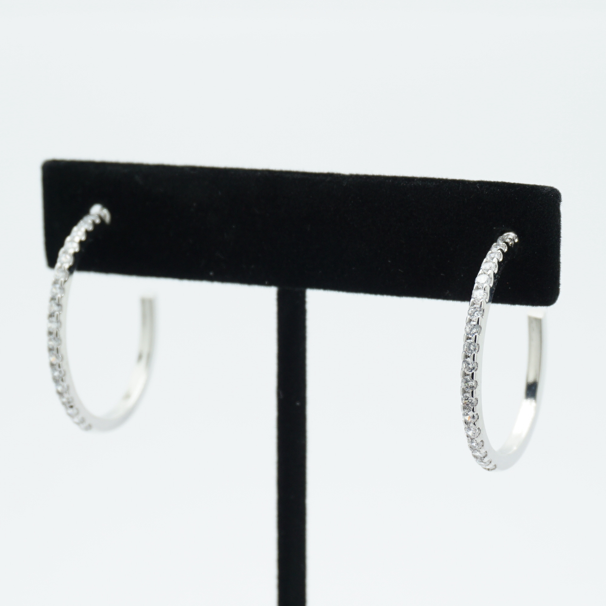 Skinny Crystal Hoop Earrings Medium in Silver on Stand