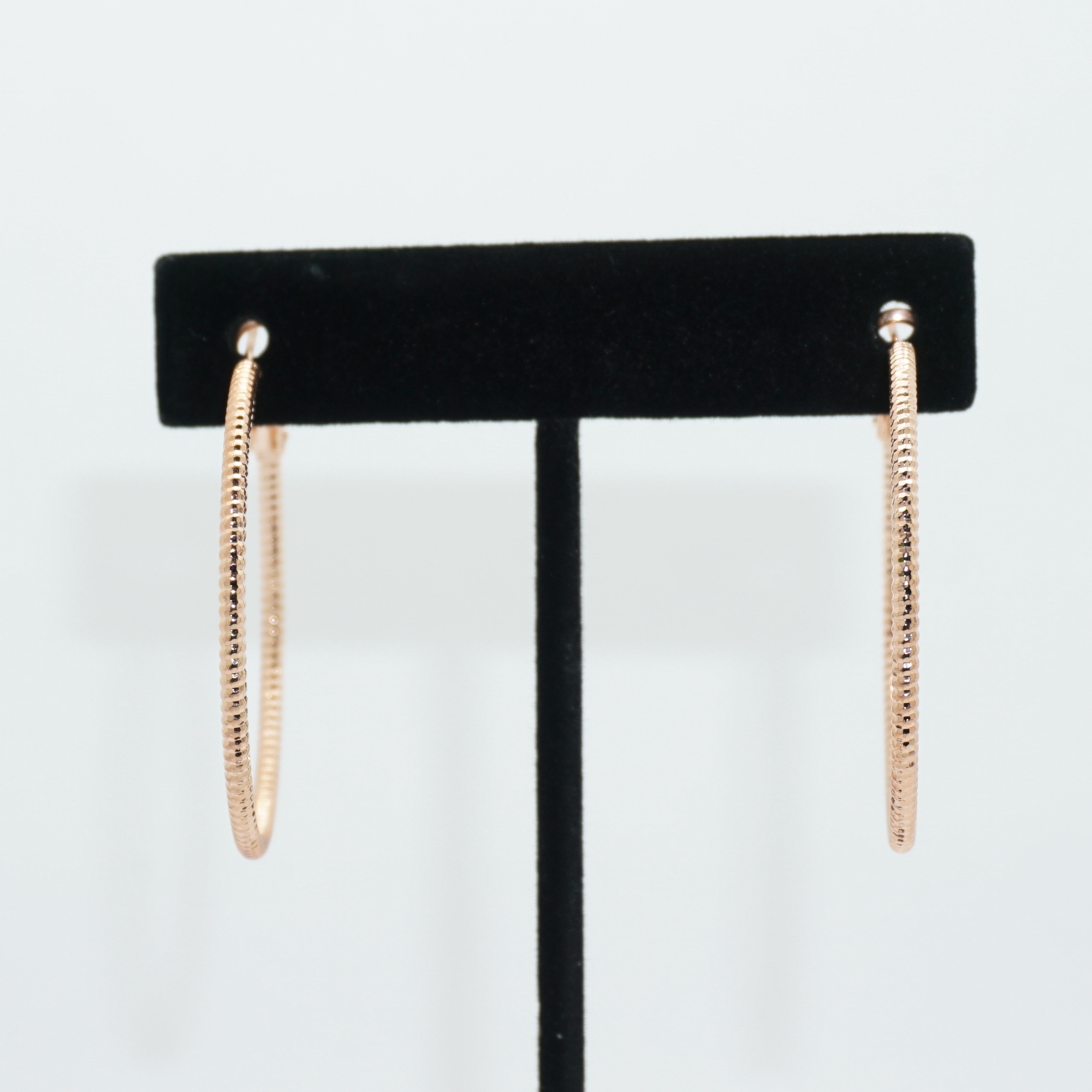 Rope Hoop Earrings Small in Rose Gold on Earring Stand